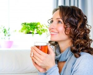 woman young drinking hot tea beatiful female favor herbal smiling smile enjoying cup drink alternative aroma aromatic beauty beverage care casual attire caucasian cold love enjoyment flu food girl green hand health healthy herb home leaf medicals medicine morning mug nature office people person portrait refreshment relaxation take tee teeth vitamin